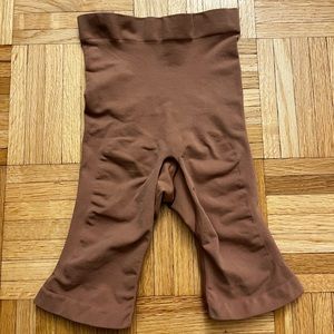 Has a slit at the crotch for easy access for bathroom needs.